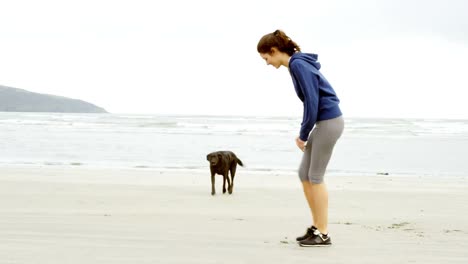 Fit-woman-warming-up-her-legs