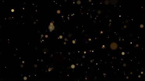 animation of glittering golden particles on black background