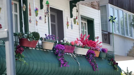 colorful flowers and decorations on a balcony of a turkish house