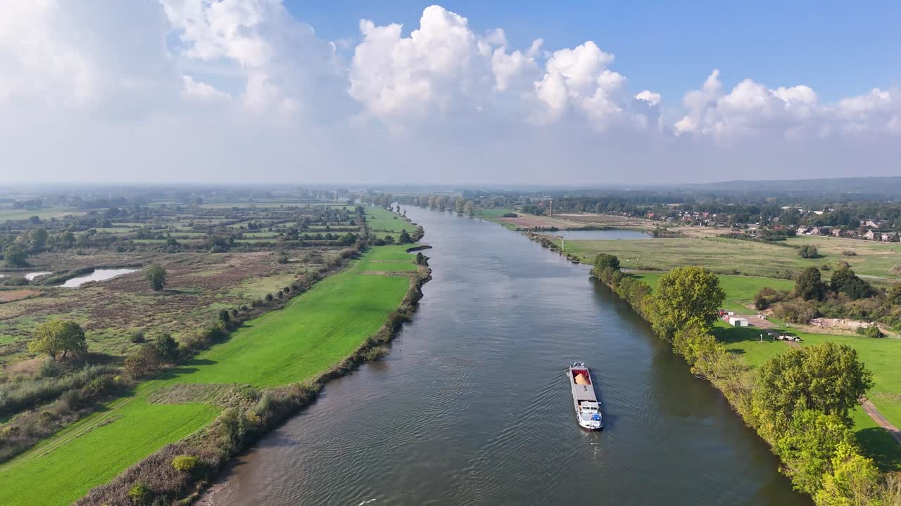 Aerial View of a River with a Barge