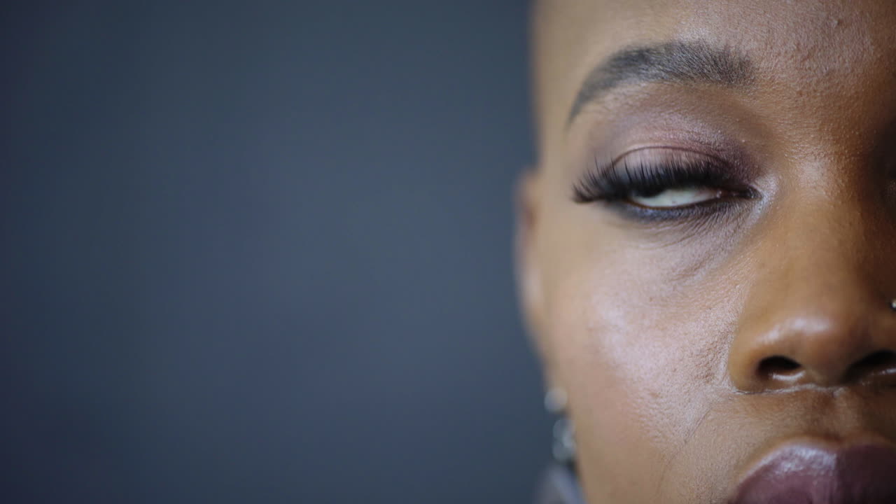 Thinking, sad and half eye of black woman