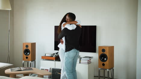 happy couple arriving to new house