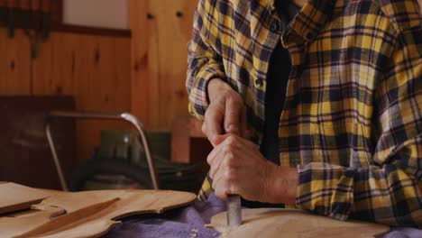 female luthier at work in her workshop