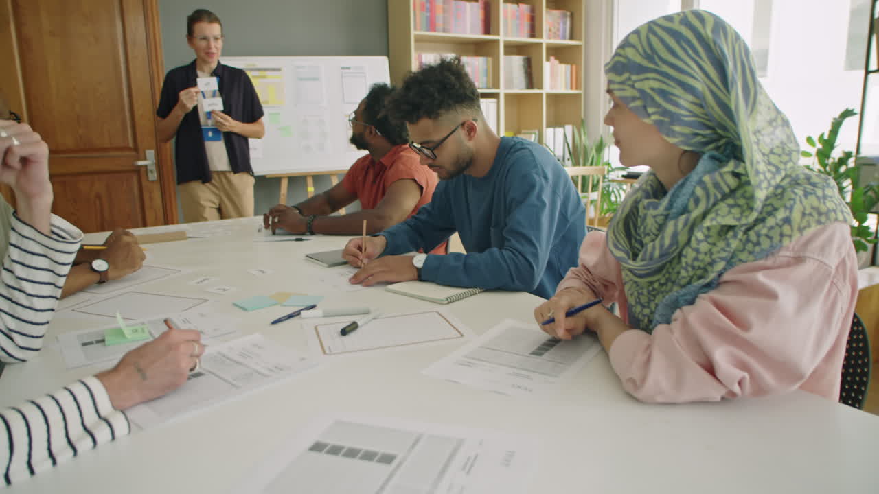 Immigrant Students Taking Notes during English Lesson