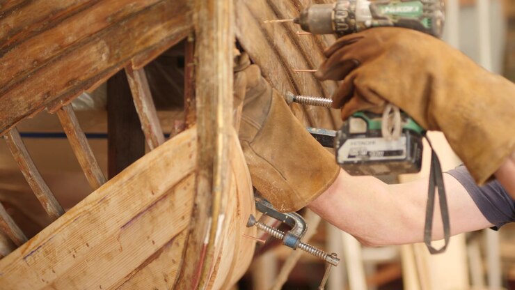 Pre drilling hull planks and oak ribs clinker wood boat repair