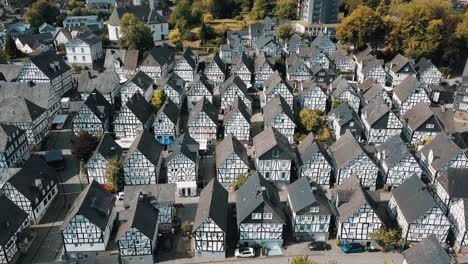 a drone flies over the identical houses of freudenberg, germany