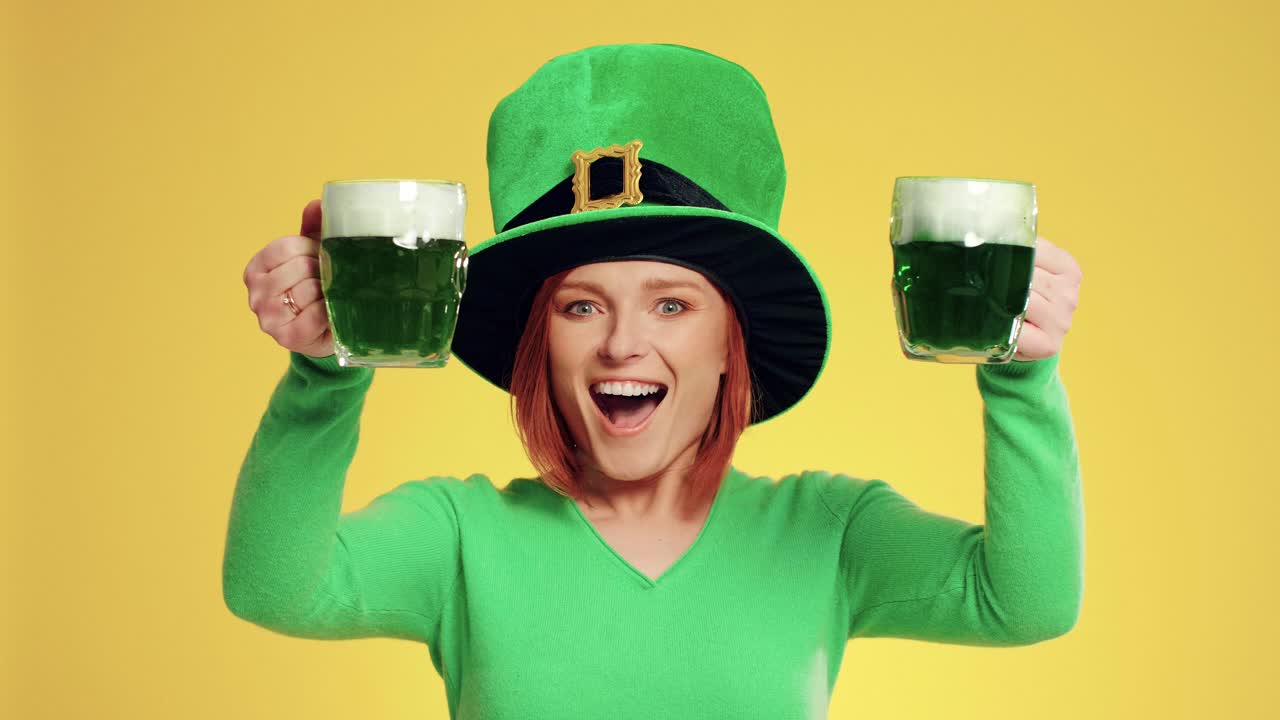 Woman with leprechaun's hat and beer celebrating Saint Patrick's Day