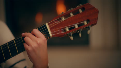 woman playing guitar writing song composing music