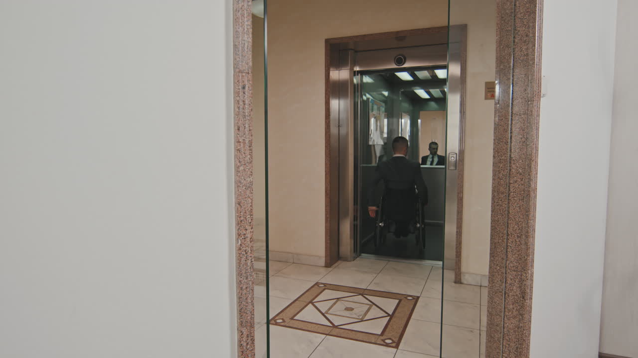 Businessman in Wheelchair Leaving Work