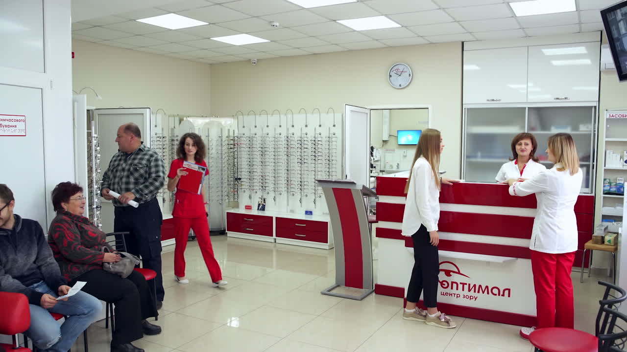 Patients Doing Medical Checkup. Waiting room with reception in medical eye clinic