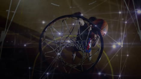 animation of networks of connections over mixed race male basketball player at gym