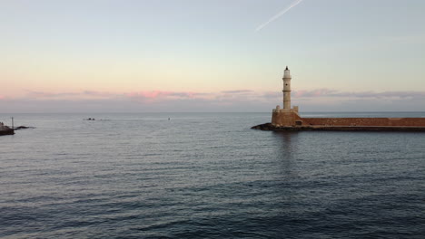 lighthouse in port with sunset