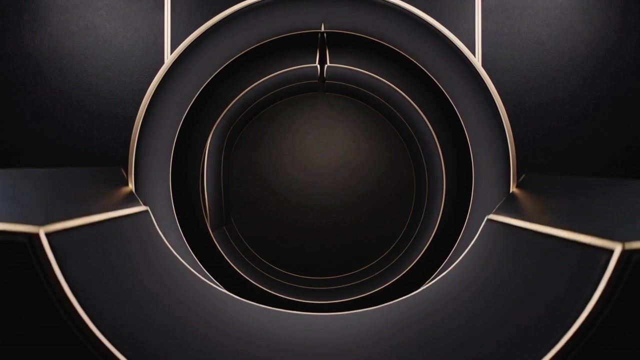 Dispositivo emergente in studio che dispiega pannelli neri bordati d'oro, formando anelli sovrapposti e un tunnel.