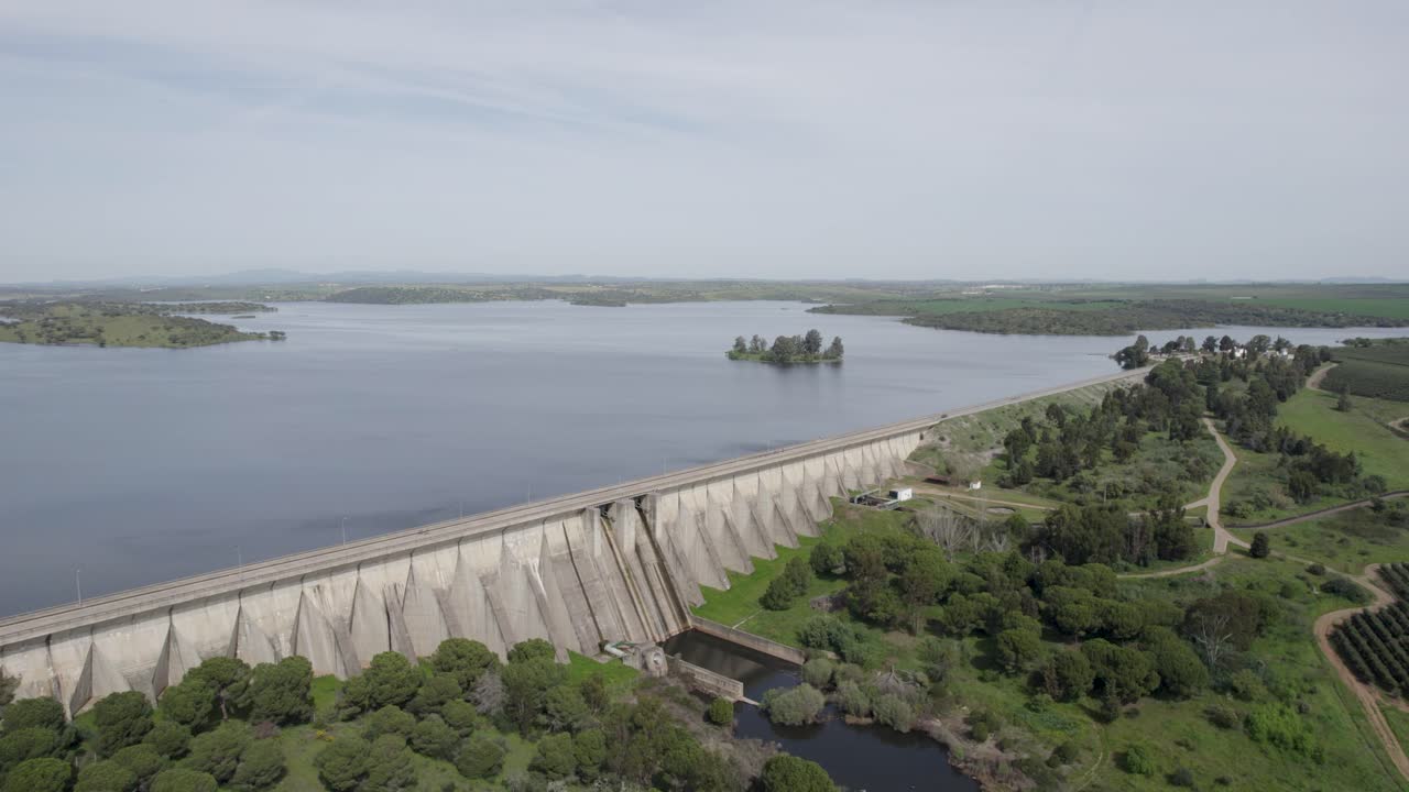 Drone follows Caia Dam extending across vast reservoir waters in Portugal