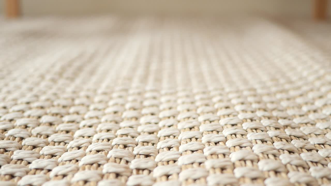Close-up of a Beige Woven Rug