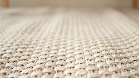 close-up of a beige woven rug