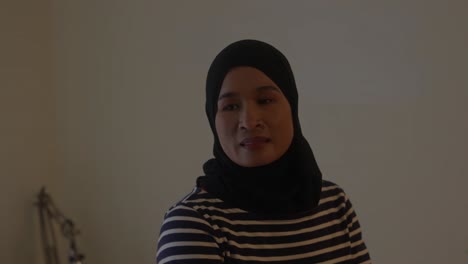 Muslim-Asian-Indonesian-Woman-in-Hijab-Gazing-and-Daydreaming