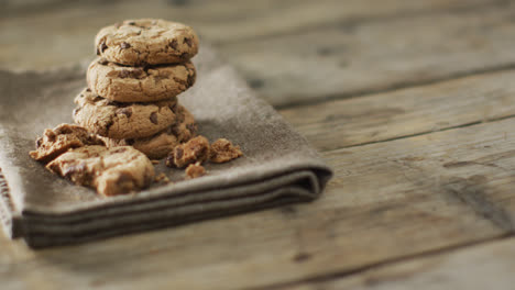 video of biscuits with chocolate on wooden background