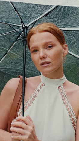woman under umbrella in the rain