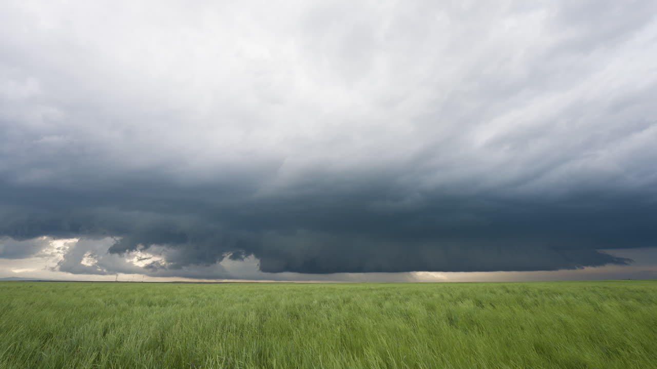 Spring Time Dark Storm Clouds Develop Over Beautiful Farm Land