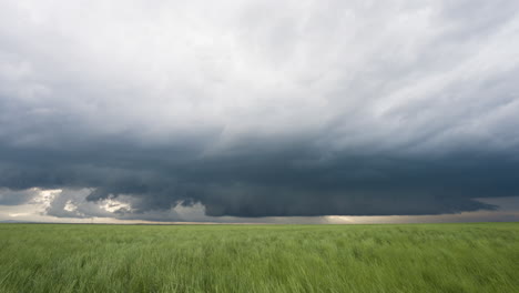 spring time dark storm clouds develop over beautiful farm land
