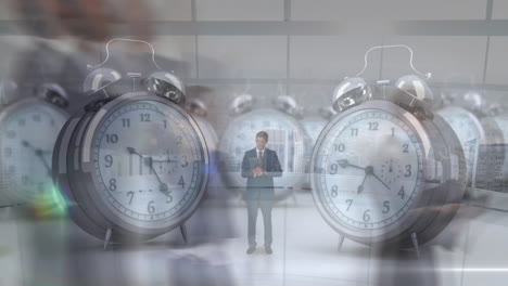 animation of ticking alarm clocks over businesspeople in fast motion