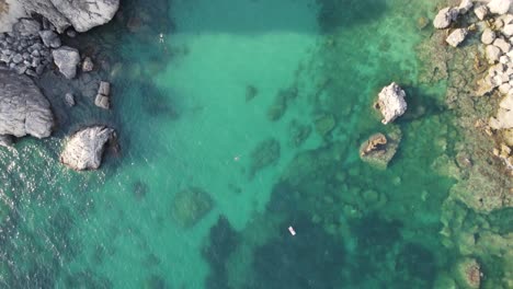 Idyllic-crystal-clear-blue-water-of-Ionian-Sea-with-rocky-shore