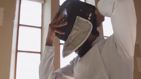 Fencer-athlete-during-a-fencing-training-in-a-gym