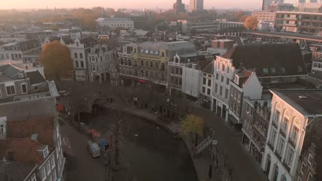 Sunrise-above-the-old-historic-Dutch-city-of-Utrecht-with-the-static-houses-along-the-canal-picking-up-the-first-sunrays-at-dusk