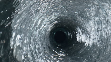 closeup bubbling water glass. organic cool cocktail rippling texture in goblet