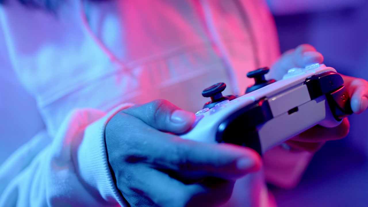 Playing video game, teenage girl holding game controller, enjoying leisure time indoors