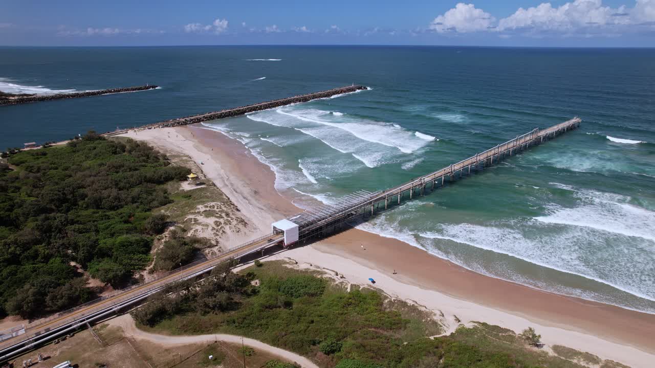 Fishing Pier And Seawall At Summer, The Spit Dog Beach In Queensland, Australia - Aerial Shot