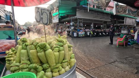 corn displayed at a busy outdoor market