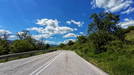 point of view dashboard video of a car driving the country side on a sunny day