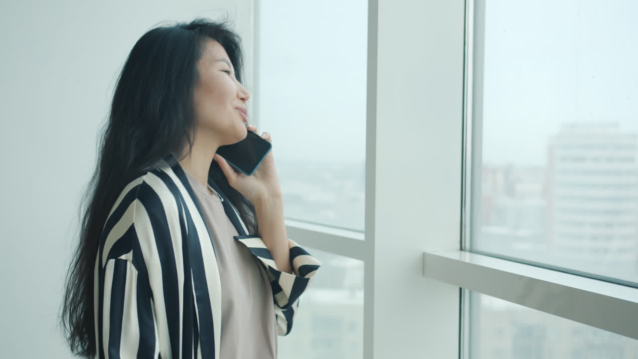 Woman on Phone by Window