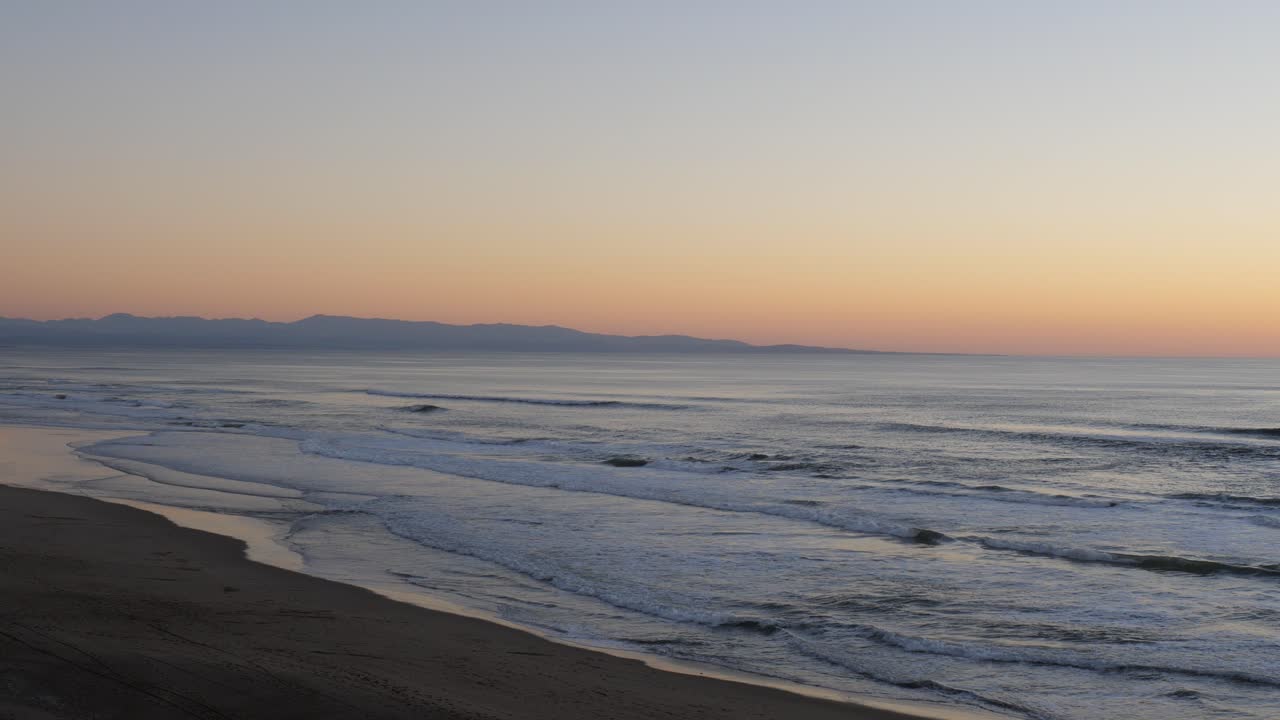 Sunset over the coastline of Santa Cruz, California. Santa Cruz beach during sunset