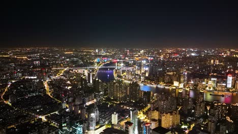 Establishing-shot-of-Huangpu-district-and-the-west-bund-in-Shanghai-downtown-at-night-time,-China