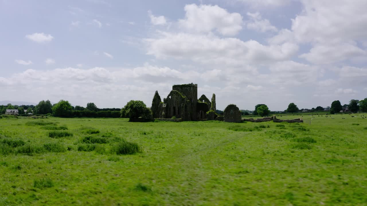 Drone shot of castle ruins in Europe's countryside.