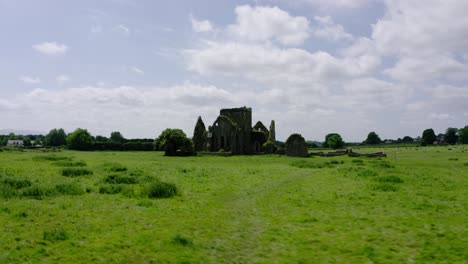 drone shot of castle ruins in europe's countryside.