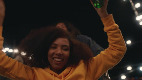 beautiful-young-woman-having-fun-sitting-in-shopping-cart-group-of-friends-enjoying-crazy-rooftop-party-at-night-playfully-celebrating-weekend