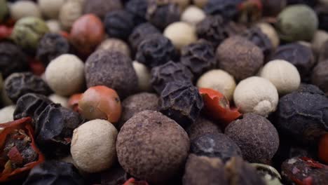 macro close-up mixed peppercorns. dry mix peppercorns close up