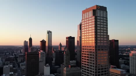 stunning moments unfold as the sun sets behind a vibrant downtown skyline. skyscrapers reflect warm tones while the city transitions into evening.