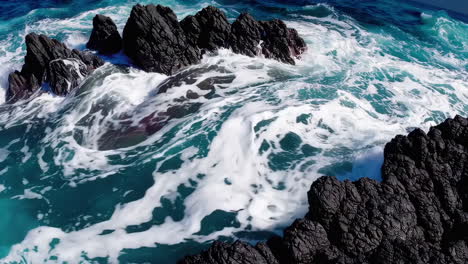 dynamic ocean waves crashing against rugged coastal rocks