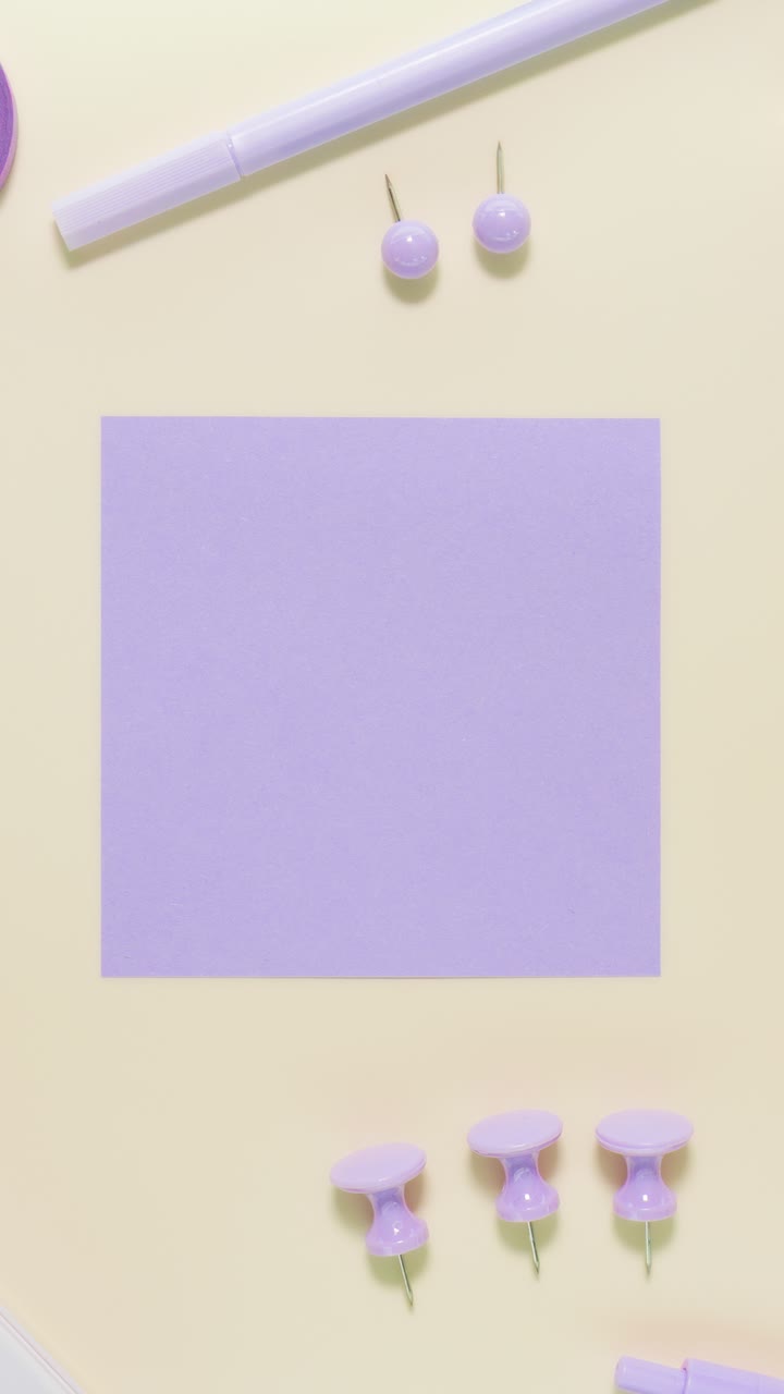 Portrait stop-motion loop of lavender stationery on pastel yellow, framing a square note used as the central copy area