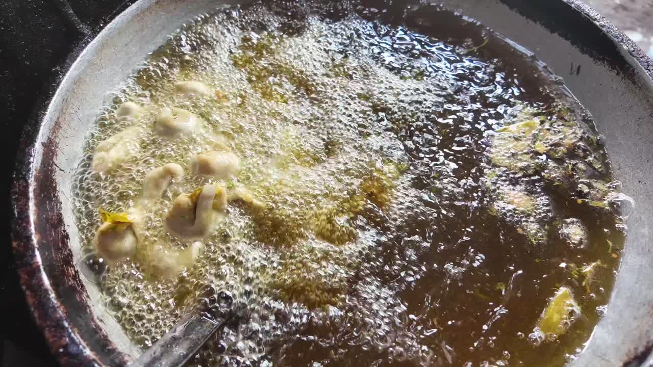 Fried Food Being Cooked in a Pan