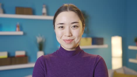 asian woman looking at camera smiling.