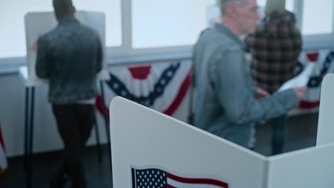 people voting in an election booth