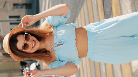 stylish woman in light blue jumpsuit