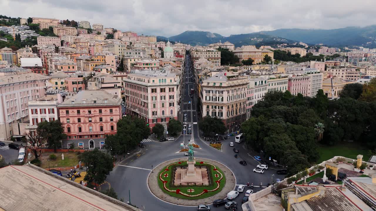 Genoa italy showing historic buildings streets and traffic under a cloudy sky, aerial view