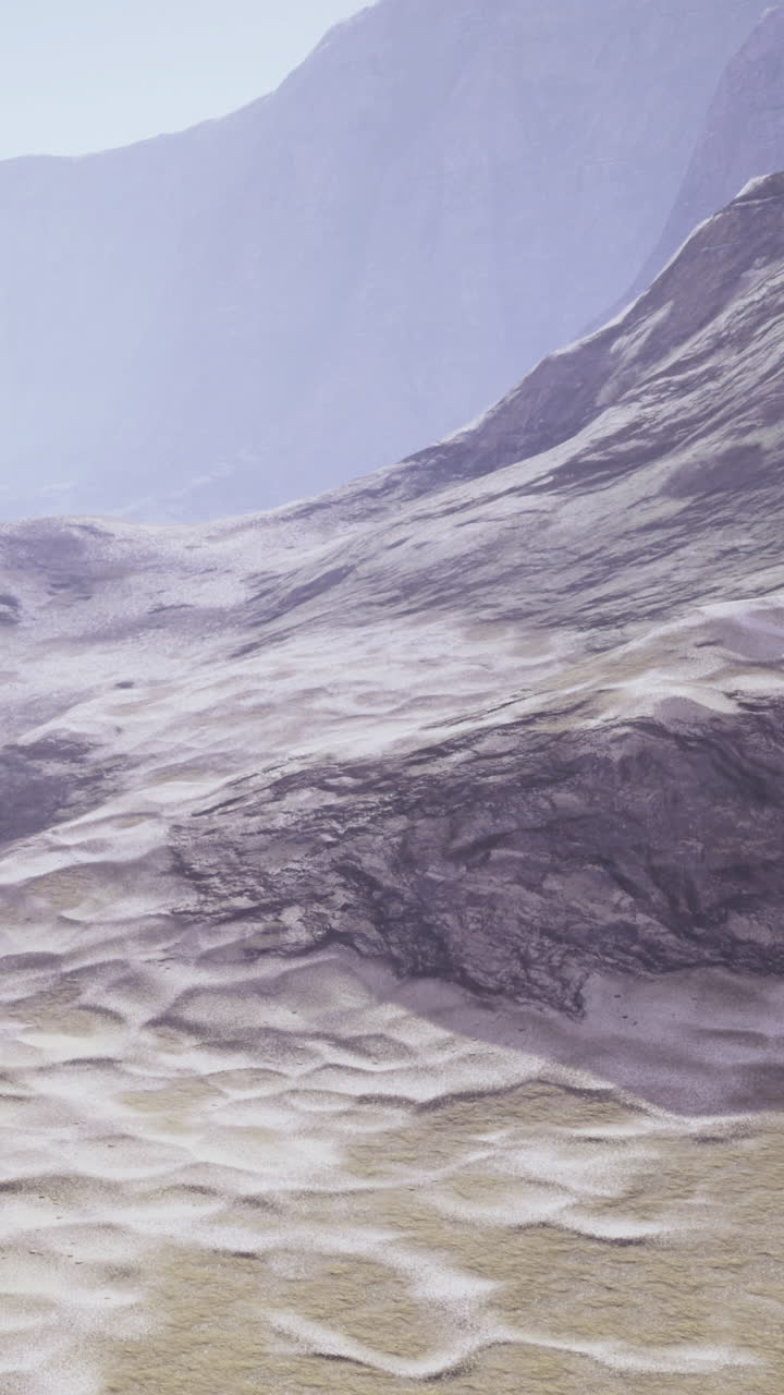 Mountains and plain during daylight in a wide landscape scene